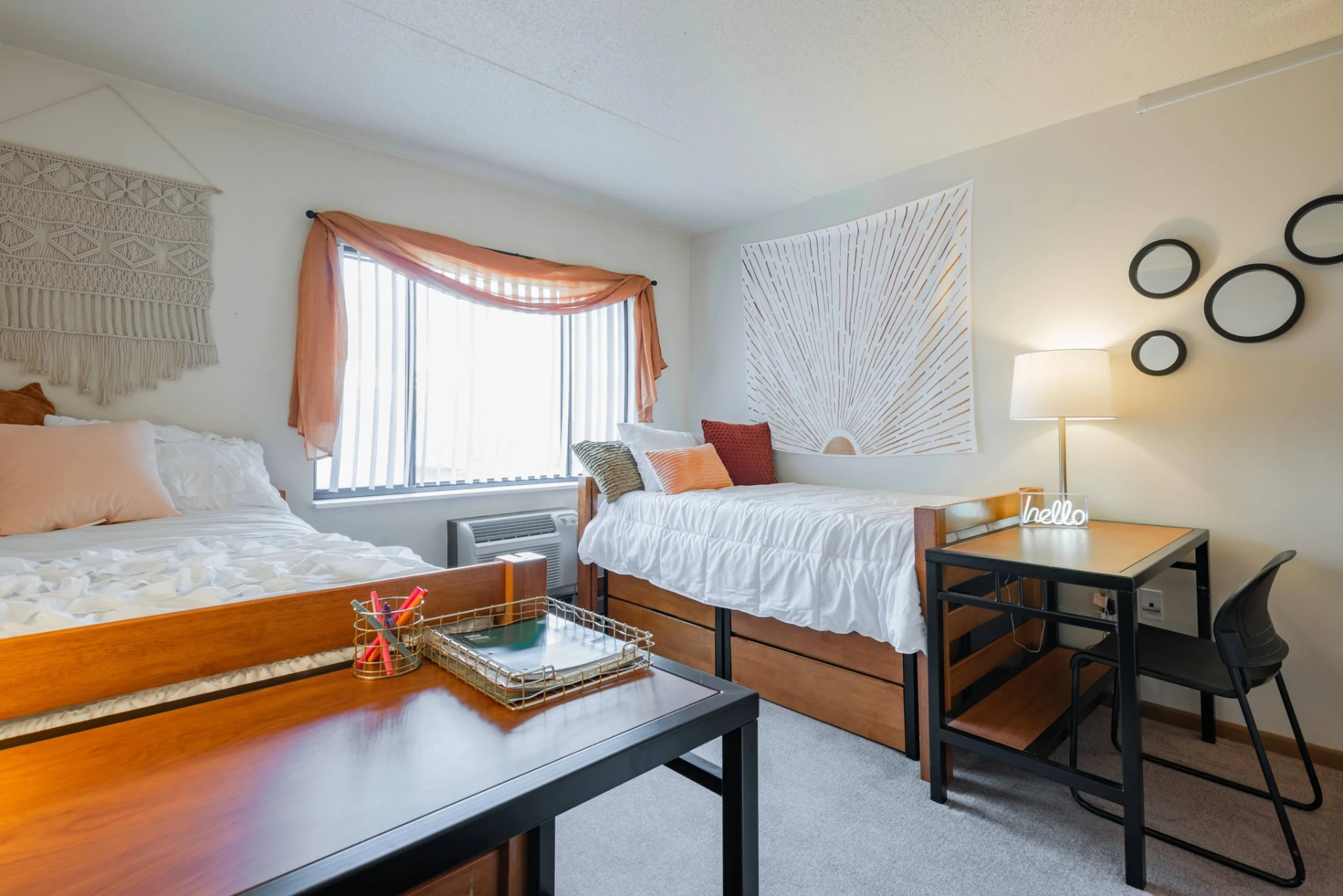 A furnished bedroom at Meridian on College Avenue, a downtown State College student apartment community near the Penn State campus.