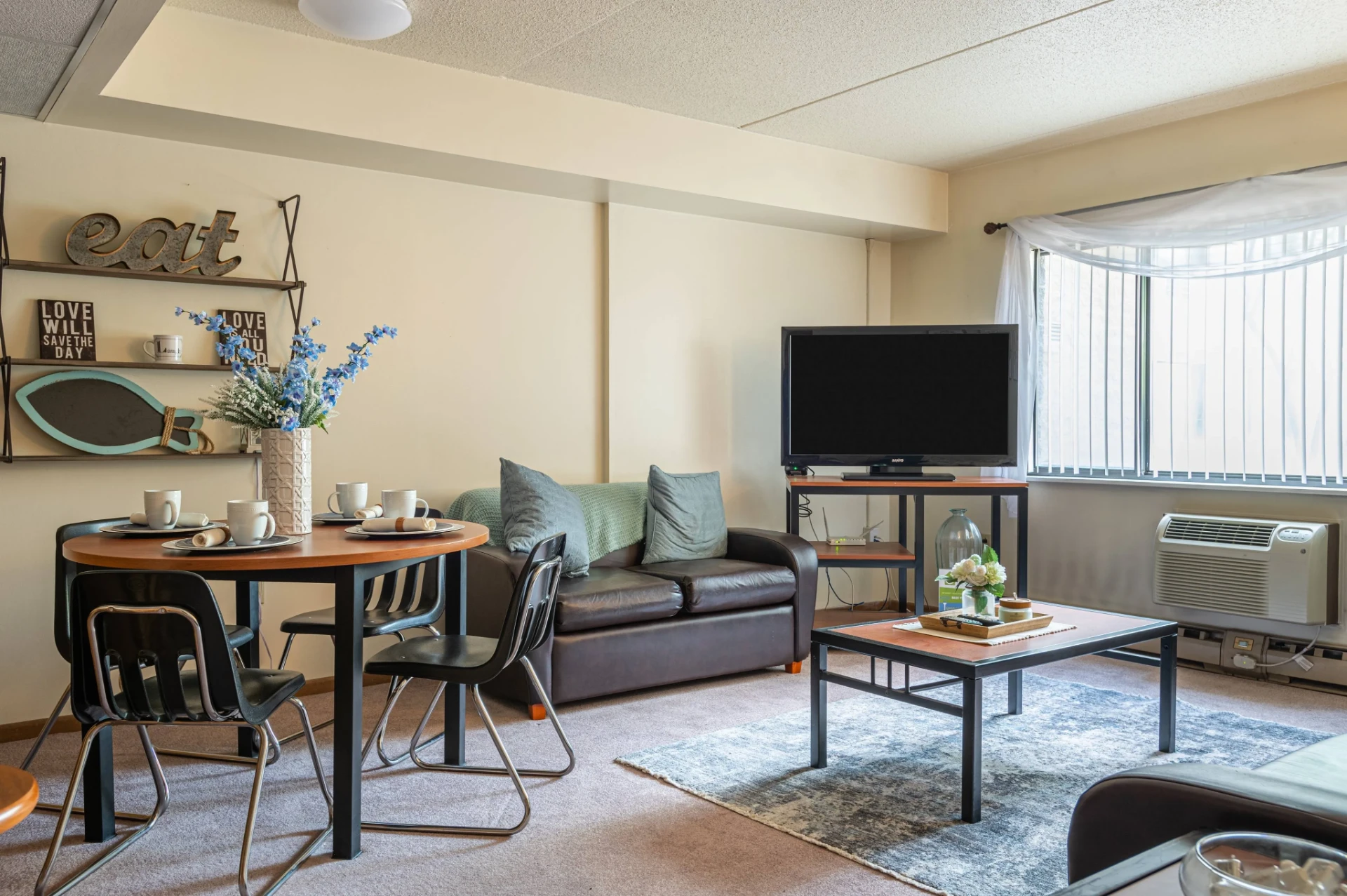 A furnished bedroom at Meridian on College Avenue in downtown State College, Pennsylvania — a purpose-built Penn State student apartment community.